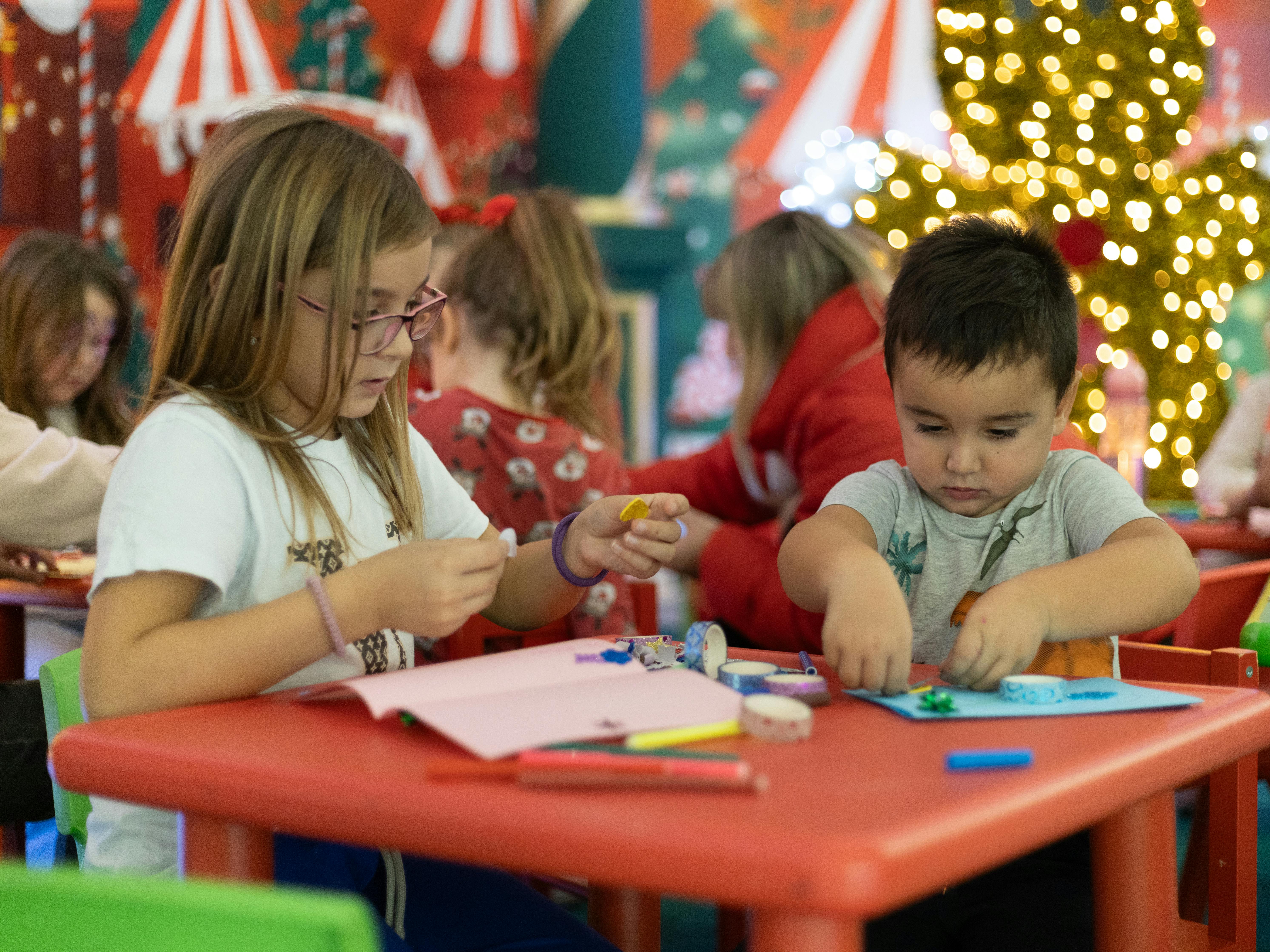 Christmas activities for schools with children making festive crafts